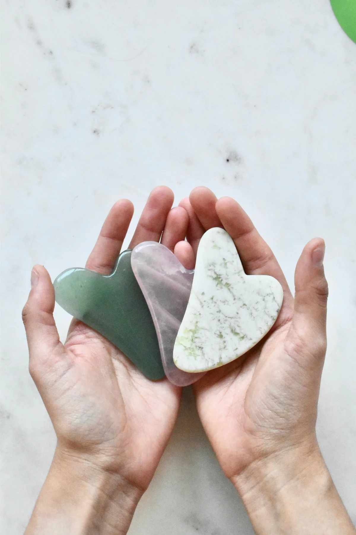 Gua Sha massage stones — jade, rose quartz and bian stone at Body Kind Studio, Krakow