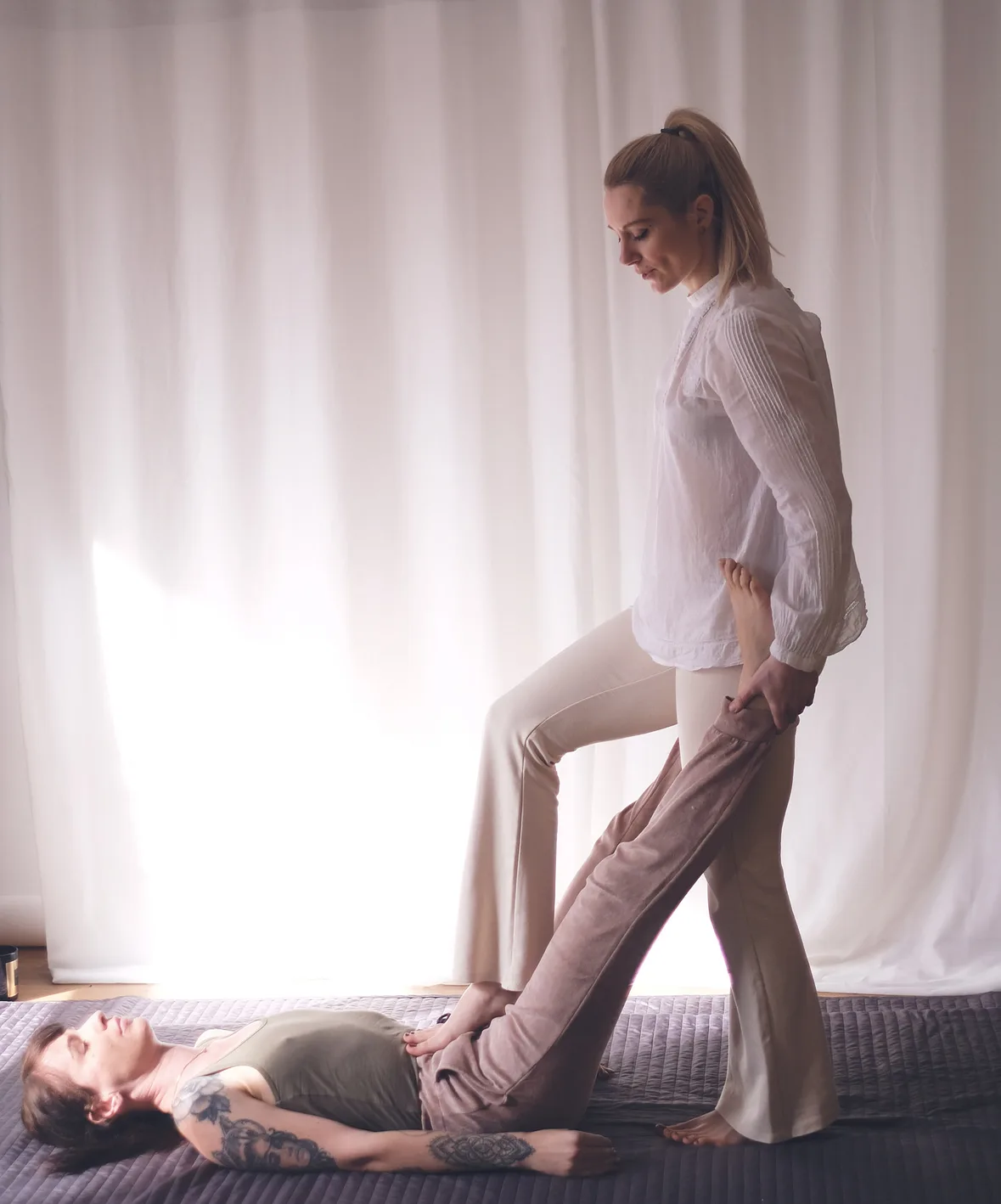 Authentic Thai massage session on floor mat at Body Kind Studio, Krakow Old Town